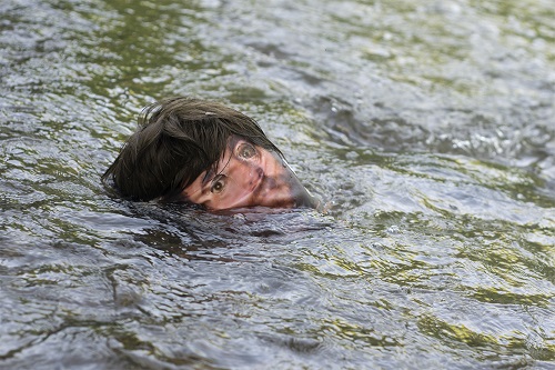 This is a picture of a mankin face in a moving stream of water by Richard Haley