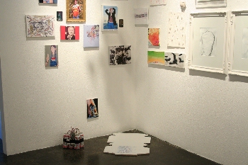 A wall and works on the floor from GIFT SHOW at ANOTHER YEAR IN LA